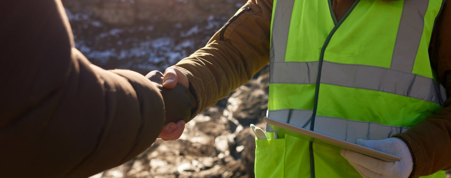 GPS Alaska workers talks to client.