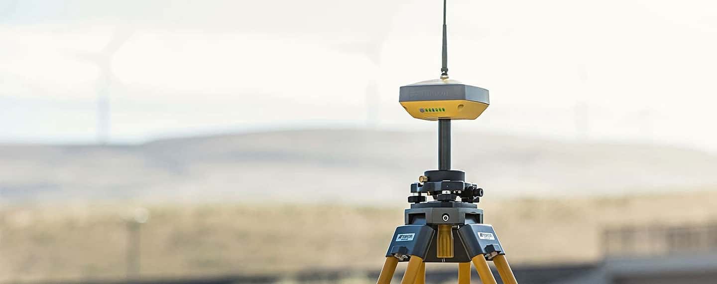 HiPer VR GNSS Receiver with windmills in the background