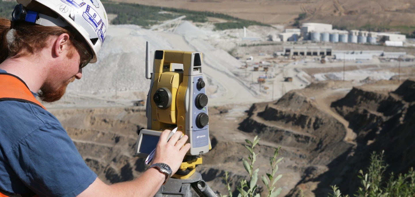 GPS Alaska worker uses surveying equipment