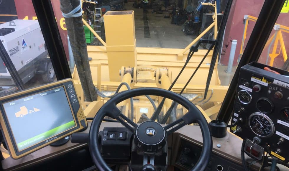 Inside dozer cab with view of 3D machine control system