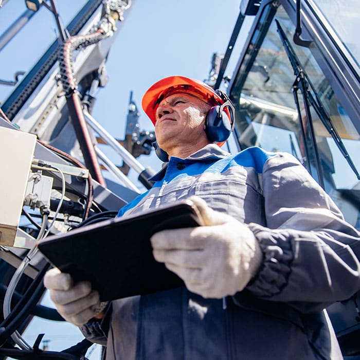 Construction worker with tablet using MAGNET Field software