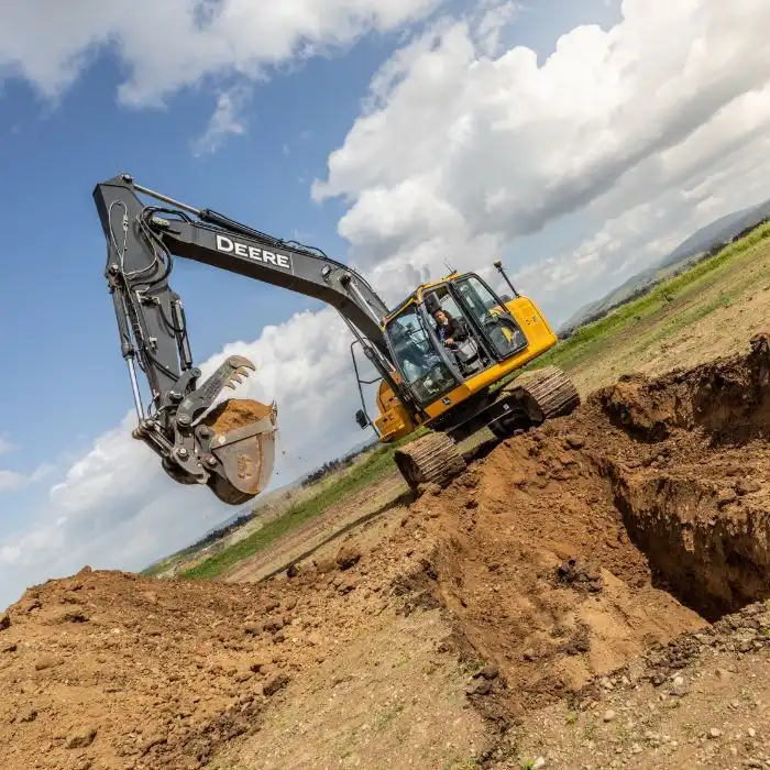 A excavator digging and using MC Max Excavator System