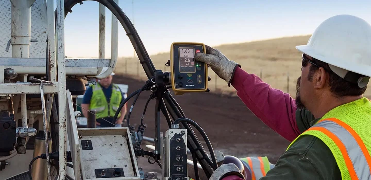 Man on jobsite uses the P-32 Paver System